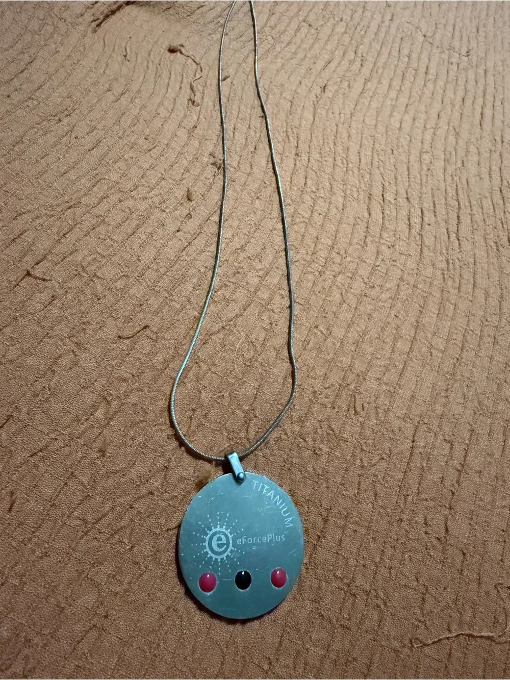 eForcePlus Titanium Round Pendant Necklace in Silver with Pink Accents